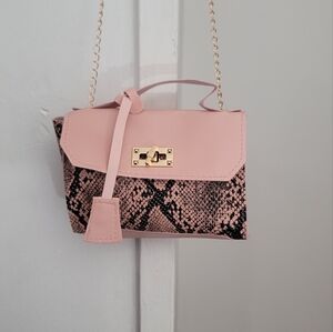 Snakeskin Print Hand Bag with Gold Crossbody Chain or Strap to carry Purse.